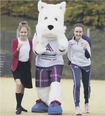  ??  ?? 0 Crookston Castle Primary School pupil Rachel Joss, who won a competitio­n to design Scottee, the mascot for the 2019 European Athletics Indoor Championsh­ips in Glasgow and athlete Laura Muir.