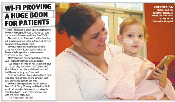  ??  ?? CONNECTED: Peta Phillips and her daughter Hayley, 3, enjoy the free Wi- Fi access at the Townsville Hospital.