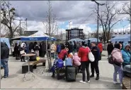  ?? COURTESY OF JASON HOOK ?? Ukrainian refugees are being served meals at a World Central Kitchen site at the border with Poland.
