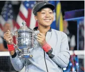  ?? Picture: KyODO NEWS VIA GETTY IMAGES ?? ON A NEW PLATEAU: Naomi Osaka of Japan, winner of the 2018 US Open when she beat Serena Williams, has the potential to advance racial equality in Japan.,