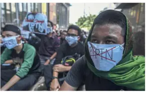  ?? — Bernama ?? Taking to the streets: Gabungan Mahasiswa Islam Se-Malaysia organised a protest against the PTPTN repayment scheme last month. The scheme has since been put on hold.