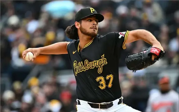  ?? Justin Berl/Getty Images ?? The Pirates’ Jared Jones delivers a pitch in the first inning during the home opener against the Baltimore Orioles at PNC Park on Friday. Jones had yet another solid outing with seven strikeouts in six innings of work.