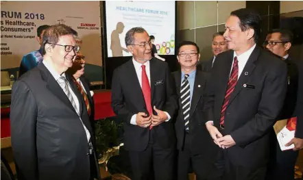  ??  ?? Health matters: Dr Dzulkefly sharing a light moment with Asian Strategy and Leadership Institute CEO Tan Sri Dr Michael Yeoh (left) and Health Ministry director-general Datuk Dr Noor Hisham Abdullah (right) after officiatin­g the Healthcare Forum 2018...