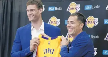  ?? Glenn Koenig Los Angeles Times ?? GM ROB PELINKA, right, said Brook Lopez “is exactly the type of individual and NBA player we targeted.”