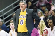  ?? Jessica Hill / Associated Press ?? UConn coach Geno Auriemma wears a jersey honoring late NBA star Kobe Bryant as he watches the Huskies play Oregon on Feb. 3.