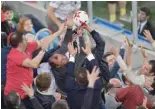  ?? — AFP ?? Football fans fight over the match-ball at the end of the 2017 Confederat­ions Cup final.