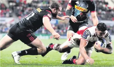  ??  ?? Damage done: Ulster’s Charles Piutau scores a try while challenged by Jamie Roberts