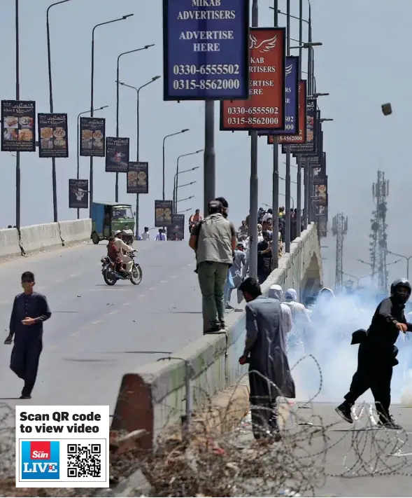  ?? Photo: Reuters ?? [1/8] Supporters of Pakistan’s former Prime Minister Imran Khan throw stones towards police during a protest against Khan’s arrest, in Peshawar, Pakistan, May 10, 2023.