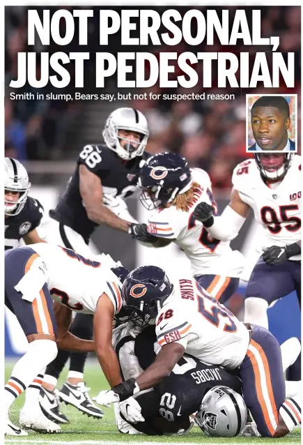  ?? NAOMI BAKER/GETTY IMAGES ?? Roquan Smith tackles the Raiders’ Josh Jacobs during a mostly ho-hum showing after returning from a personal issue.