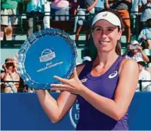  ?? AFP ?? Johanna Konta of Great Britain poses with the trophy after winning the final of the Bank of the West Classic.