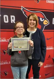  ?? SUBMITTED ?? Orchard Hollow fourth-grader Tia Geisler poses with Principal Jeniffer Harris after being recognized at the March 14school board meeting for qualifying for the National Spelling Bee.