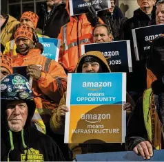  ??  ?? With 25,000 jobs at stake, supporters of Amazon’s proposed headquarte­rs in Queens were on the steps of City Hall recently.