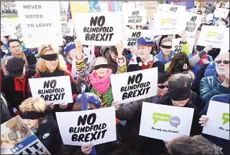  ?? (AP) ?? Remain in the European Union supporters wear blindfolds as they take part in a protest event organised by the People’s Vote Campaign, which calls for a second referendum on Britain’s EU membership, in Parliament Square,London, Feb 14.