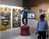  ?? AFP ?? A visitor walks past exhibits at the National Museum of Indian Cinema in Mumbai. —