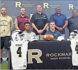  ?? kevin Myrick ?? Rockmart football coaches joined Juke Boozer and Reed Couch for photos during their college selection ceremony on Feb. 5.