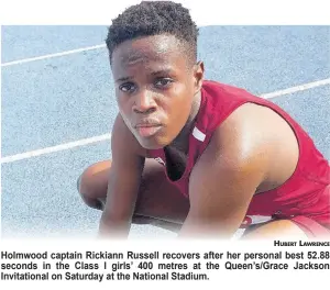  ?? HUBERT LAWRENCE ?? Holmwood captain Rickiann Russell recovers after her personal best 52.88 seconds in the Class I girls’ 400 metres at the Queen’s/Grace Jackson Invitation­al on Saturday at the National Stadium.