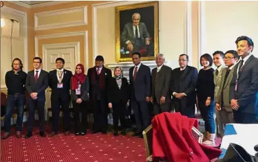  ??  ?? Recipe for advancemen­t: Nancy (sixth from left) taking a group photo with students at event. With them are (from Nancy’s left) Reezal Merican, Dr Mohd Zamzam and Ahmad Rasidi.