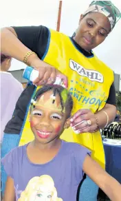  ??  ?? Bright, and beautiful! At a past event, little Sphesihle Hlophe was sprayed by her ‘stylist’ - Sister Phumzile Mnqayi of CANSA Zululand Observer