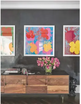  ??  ?? Lobby
Greg’s collection of Andy Warhol Flower
prints make a striking first impression.
Get the look This is a BDDW sideboard.