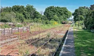  ?? DON BISHOP ?? Below: A similar scene at the WSR's Dunster station on the same day, giving the site a sense of abandonmen­t. The railway is actively working to stay on top of such growth.