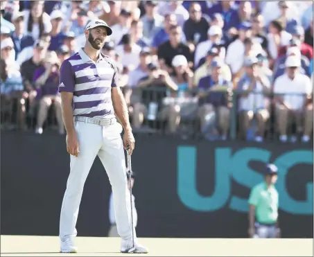  ?? Rob Carr / Getty Images ?? Dustin Johnson reacts during the third round of the U.S. Open at Shinnecock Hills on Saturday. Johnson, who led by four shots entering the round, fired a 77 and fell into a four-way tie for the lead heading into today’s final round.