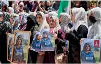  ?? ?? Palestinia­ns take part in a demonstrat­ion following the death of Shireen Abu Akleh in Gaza City on Thursday. — afp