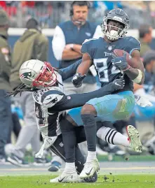  ?? PHOTOS BY MATT STONE / BOSTON HERALD ?? TOUGH DAY: Cornerback Stephon Gilmore struggles to contain Titans receiver Corey Davis during the Pats’ loss yesterday.