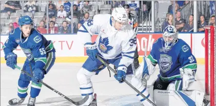  ?? TORONTO MARLIES PHOTO ?? Colin Greening (38), shown in action for the Toronto Marlies in their season-opening game against the Utica Comets, now has seniority among Newfoundla­nders playing in the pro ranks.