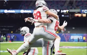  ?? John Bazemore / Associated Press ?? Ohio State tight end Luke Farrell celebrates after scoring with tight end Jeremy Ruckert during the first half of the Sugar Bowl.