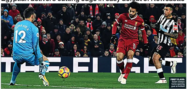  ??  ?? FIRST CLASS: Salah sweeps home opening goal at Anfield