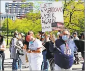  ?? Christine Stuart / CTNewsJunk­ie.com ?? About 300 people gather Wednesday in Hartford to protest the speed at which the state is reopening its economy.