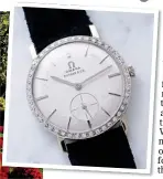  ?? ?? FIT FOR THE KING: Elvis’s $1 million diamond-encrusted watch, above. Left: Geneva’s flower clock