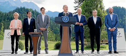  ?? AP ?? German Chancellor Olaf Scholz, centre, with, from left, European Commission president Ursula von der Leyen, Japanese Prime Minister Fumio Kishida, Canadian PM Justin Trudeau, US President Joe Biden, Italian PM Mario Draghi, and European Council president Charles Michel, during the launch of a global infrastruc­ture partnershi­p on the margins of the G7 Summit in Elmau, Germany, yesterday (NZ time).