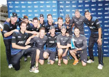  ??  ?? AUCKLAND: New Zealand players celebrate winning the series 2-0 after the third one-day internatio­nal cricket match between New Zealand and Pakistan at Eden Park in Auckland yesterday. —AFP