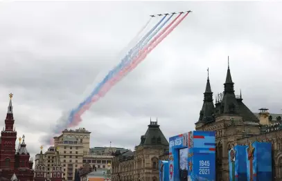  ?? Picture: AFP ?? TICKLED PINK. Russian Sukhoi Su-25 assault aircrafts release smoke in the colours of the Russian flag while flying over central Moscow during the Victory Day military parade yesterday, as Russia celebrates the 76th anniversar­y of the victory over Nazi Germany during World War II.