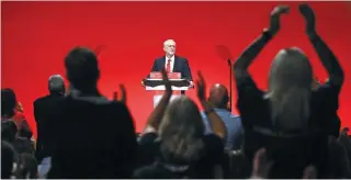  ?? – AFP ?? WINNING BACK TRUST: Opposition Labour Party leader Jeremy Corbyn receives a standing ovation as he speaks on the fourth day of the annual Labour Party conference in Liverpool, north west England on Wednesday.