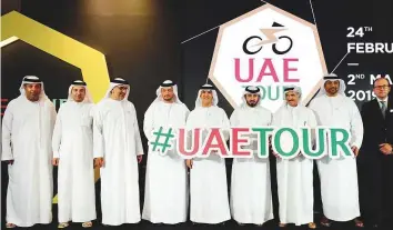  ?? Arshad Ali/Gulf News ?? Members of the Abu Dhabi, Dubai and Sharjah Sports Councils and UAE Tour organisers during the press conference of UAE Tour logo and trophy (below) unveiling in Dubai.