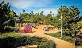  ?? Santa Monica Travel & Tourism ?? Top: The Santa Monica Pier boasts a solar-powered Ferris wheel. Above: Tongva Park is an urban oasis,with native and drought-tolerant species, on a former parking lot site.