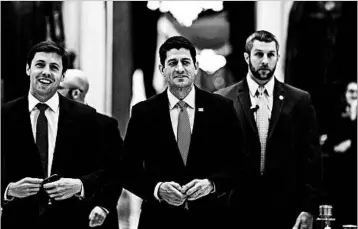  ?? JIM LO SCALZO/EPA ?? Speaker Paul Ryan, center, walks to the House floor, where representa­tives were voting on a budget resolution Friday.