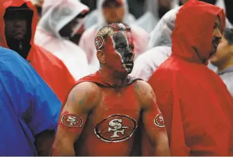  ?? Alex Brandon / Associated Press ?? A 49ers fan watches the team’s 90 victory over Washington last Sunday in Landover, Md.