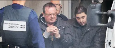  ?? VINCENZO D’ALTO ?? Raynald Desjardins, left, and Felice Racaniello exit the Joliette courthouse in 2011. Desjardins received a 14-year sentence in the first-degree murder of Salvatore Montagna on Monday.