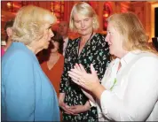  ??  ?? Camilla, Duchess of Cornwall, chatting to Ronnie Dorney and Eleanor Moore at Cork City Hall.