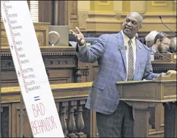  ?? BOB ANDRES / BANDRES@AJC.COM ?? Sen. Emanuel Jones, D-Decatur, opposes the campus carry bill in the Senate with the aid of a prop. State Sen. Bill Heath, R-Bremen, presented House Bill 280 in the Senate. The legislatio­n allows guns onto any campus in Georgia’s public college system....