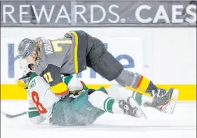  ?? L.E. Baskow Las Vegas Review-journal @Left_eye_images ?? Golden Knights center William Karlsson gets tangled up with Minnesota Wild left wing Jordan Greenway in Thursday night’s 3-2 shootout loss at T-mobile Arena.