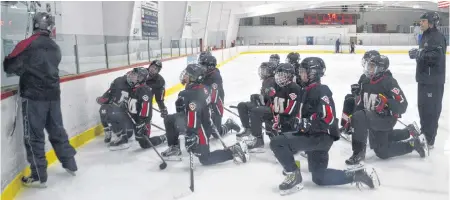  ?? JEREMY FRASER • CAPE BRETON POST ?? Members of the Glace Bay Miners under-15 ‘A’ hockey team wait to take part in a drill during team practice and the Dominion Arena on Wednesday. The club will be one of 14 Glace Bay teams donating to the Christmas Crew program this weekend.