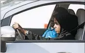  ?? AMR NABIL/AP ?? A student at the female-only campus of Effat University sits for the first time in the driver’s seat during training.