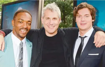  ??  ?? Walker with co-star
Anthony Mackie (left) and producer Jim Lemley during the New York premiere of the movie,
and also with his wife Mamie Gummer (inset), daughter of
Meryl Streep