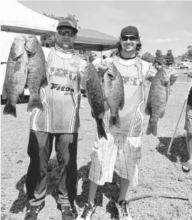  ?? PHOTO COURTESY OF CHRIS MALCZEWSKI ?? Chris Malczewski, left, and Kyle Gabriele grew up together in Canton. Malczewski now lives in East Baltimore and Gabriele in the Rosedale-White Marsh area, but they still fish together. For more pictures of the anglers, go to baltimores­un.com/outdoors.