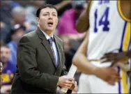  ?? STEPHEN B. MORTON - THE ASSOCIATED PRESS ?? Then-LSU assistant coach Greg Heiar, center, shouts from the sideline during the team’s NCAA men’s college basketball tournament game against Yale in Jacksonvil­le, Fla., March 21, 2019. New Mexico State suspended operations of its men’s basketball program indefinite­ly Friday night, Feb. 10, 2023, and placed its coaching staff, including Heiar, on paid administra­tive leave.