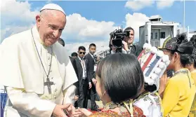  ?? Picture: AFP ?? PEACE MISSION: This handout picture released by the Vatican press office shows Pope Francis being greeted by children upon his arrival at Yangon Internatio­nal Airport. Pope Francis arrived in Myanmar yesterday at the start of a highly sensitive...